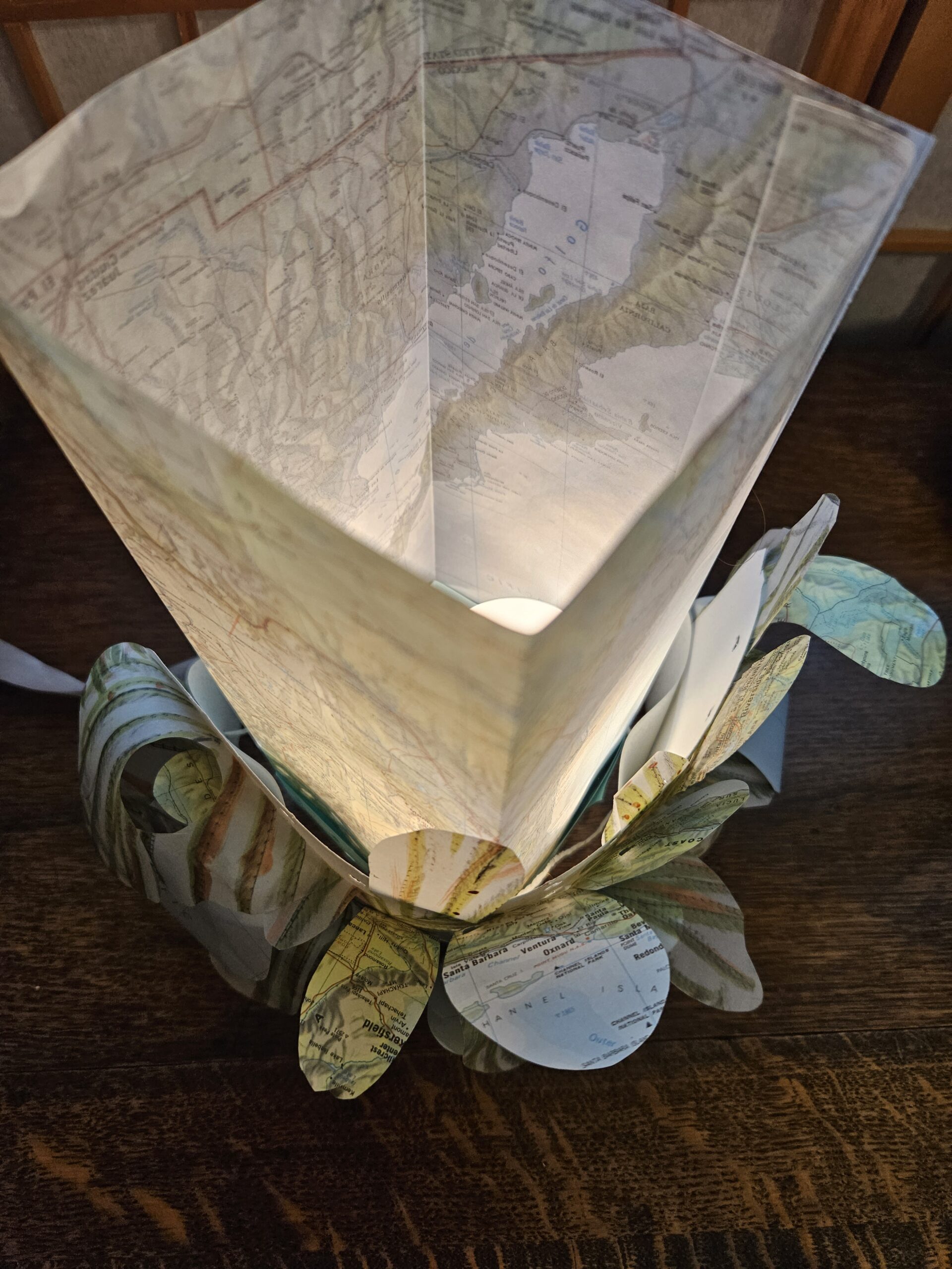 a paper lantern using maps, various papers and botanic rubbings with watercolour and ink