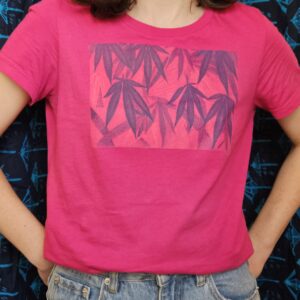 a pink t-shirt with cannabis leaf design